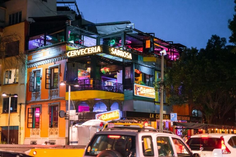 Colorful and lively bar scene at night in Ciudad de México's vibrant district.